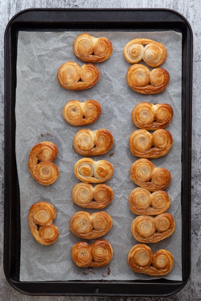 Palmiers baked on a cookie sheet.