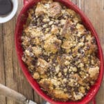 Panettone bread pudding in a red pan.
