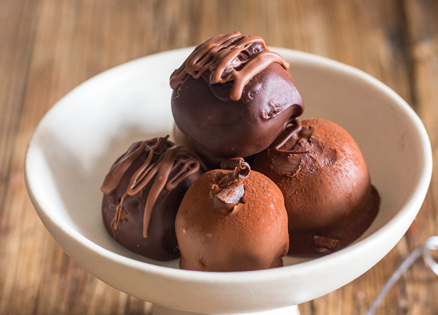 4 tiramisu truffles in a white bowl