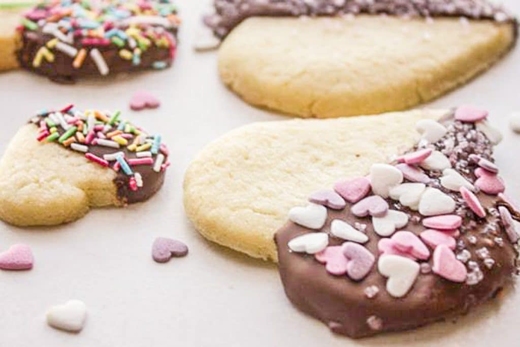 Dipped cookies on a white board.