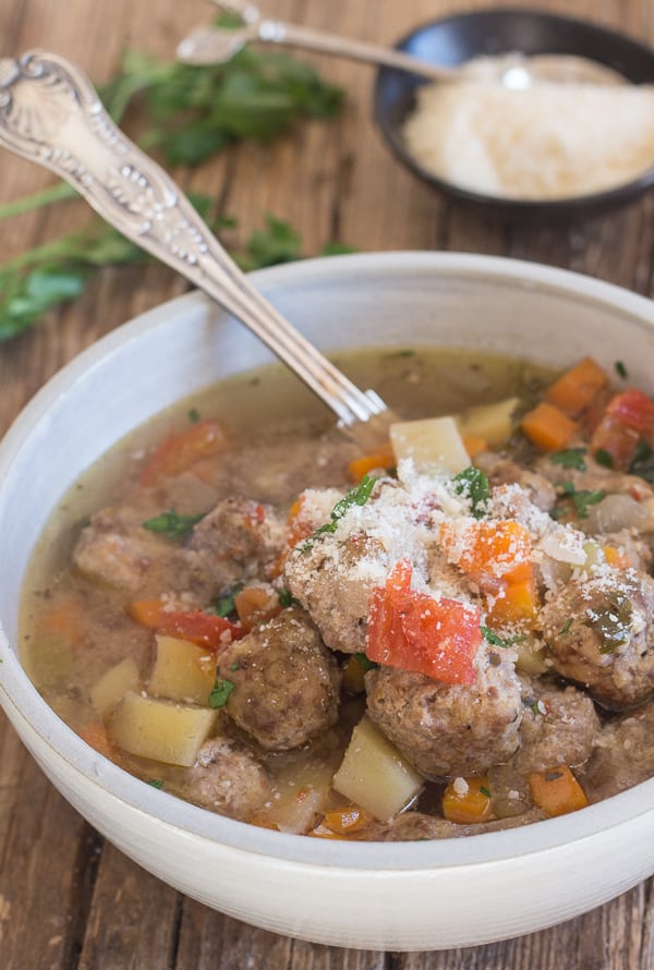 Italian meatball soup in a white bowl