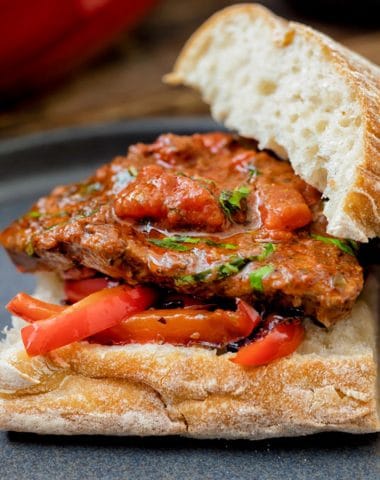 Pizzaiola on a sandwich with fried peppers.