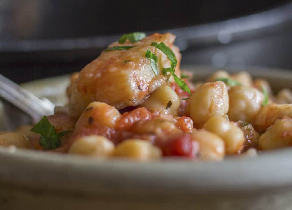 Baccala chickpeas in a grey bowl.