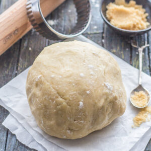 Brown sugar pie crust on a piece of parchment paper.