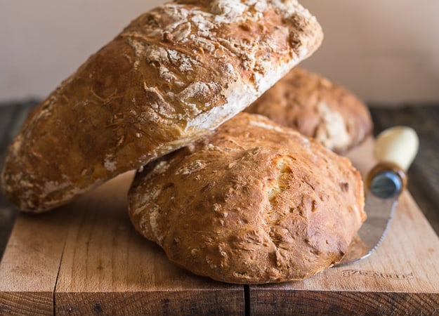 one loaf of no knead bread recipe on top of another