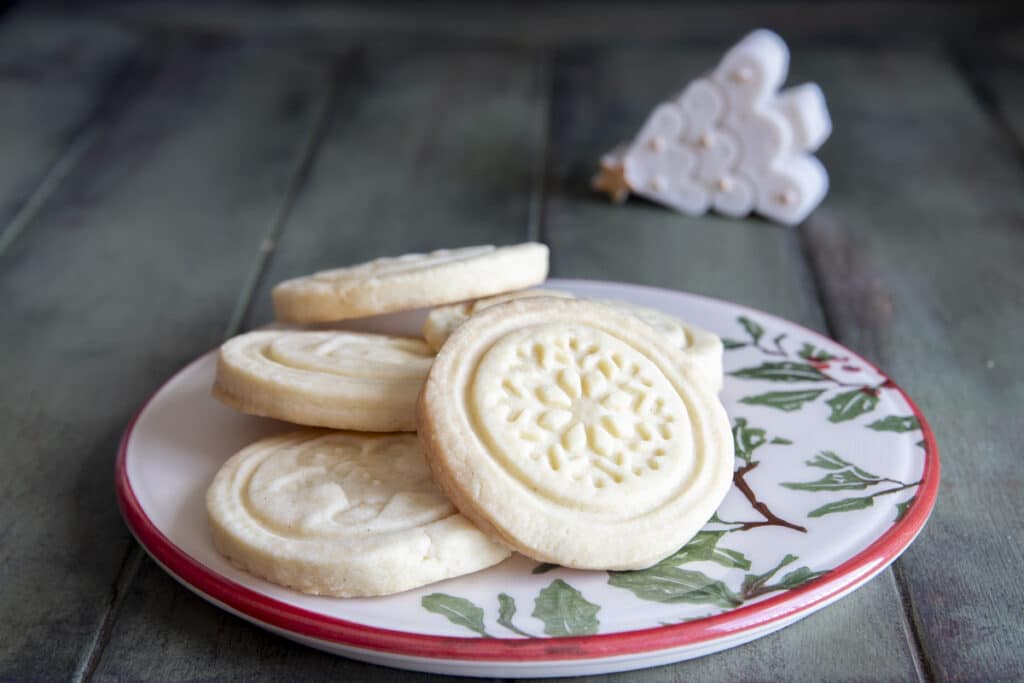 Stamped shortbread cookies on a plate.