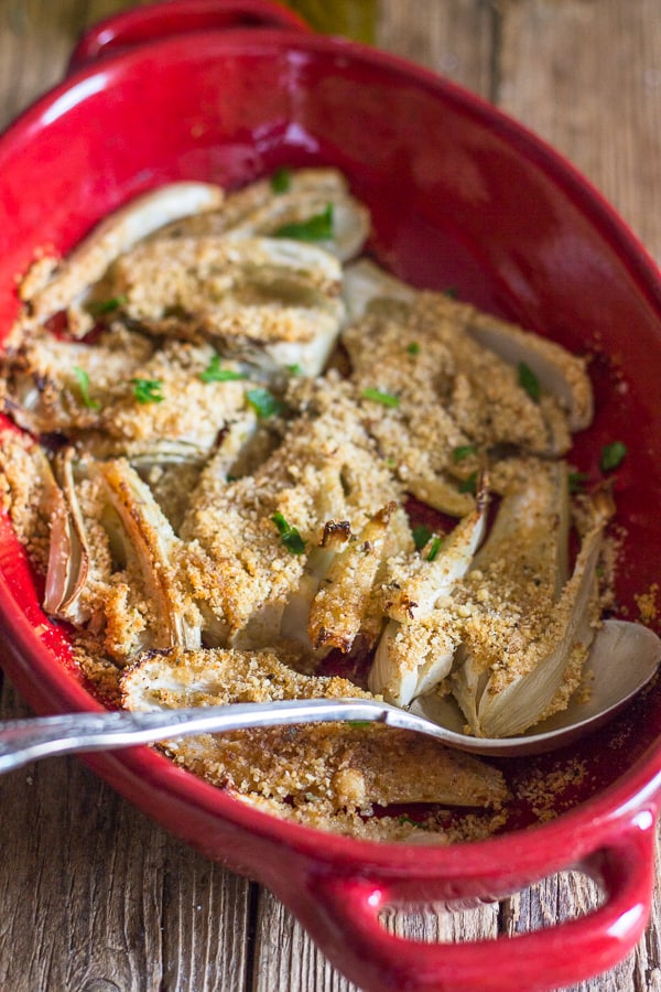 baked fennel in a red baking dish