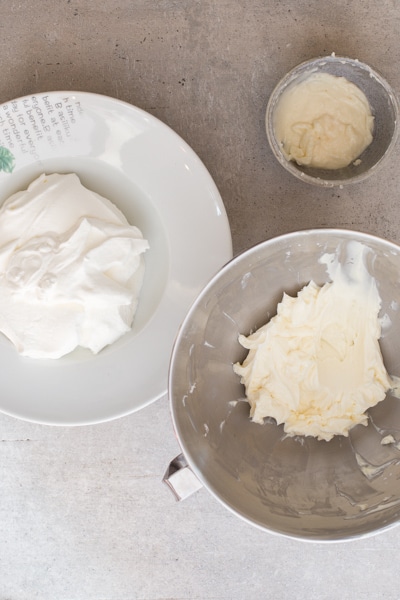 beating the whipped cream and the cream cheese mixture in separate bowls