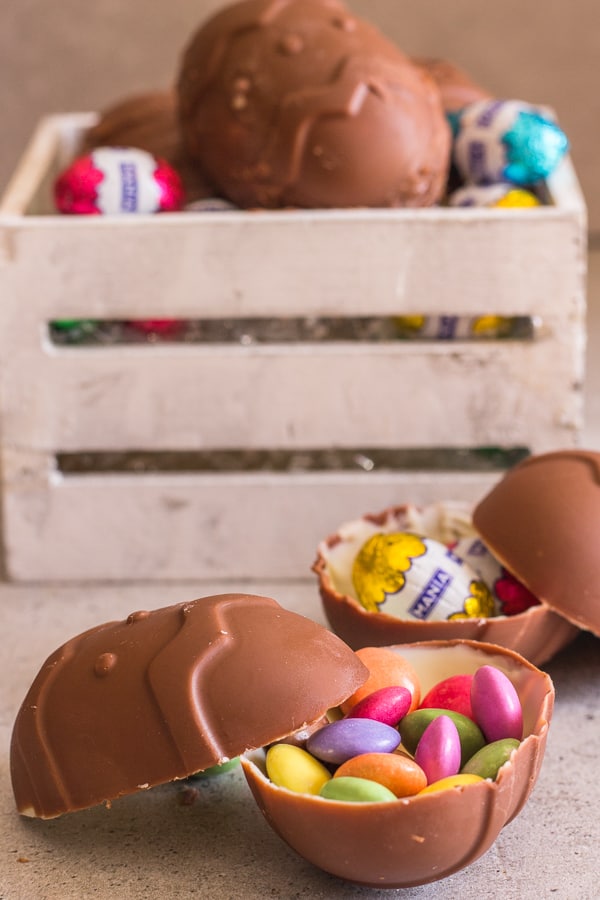 chocolate easter eggs in a box and on a board