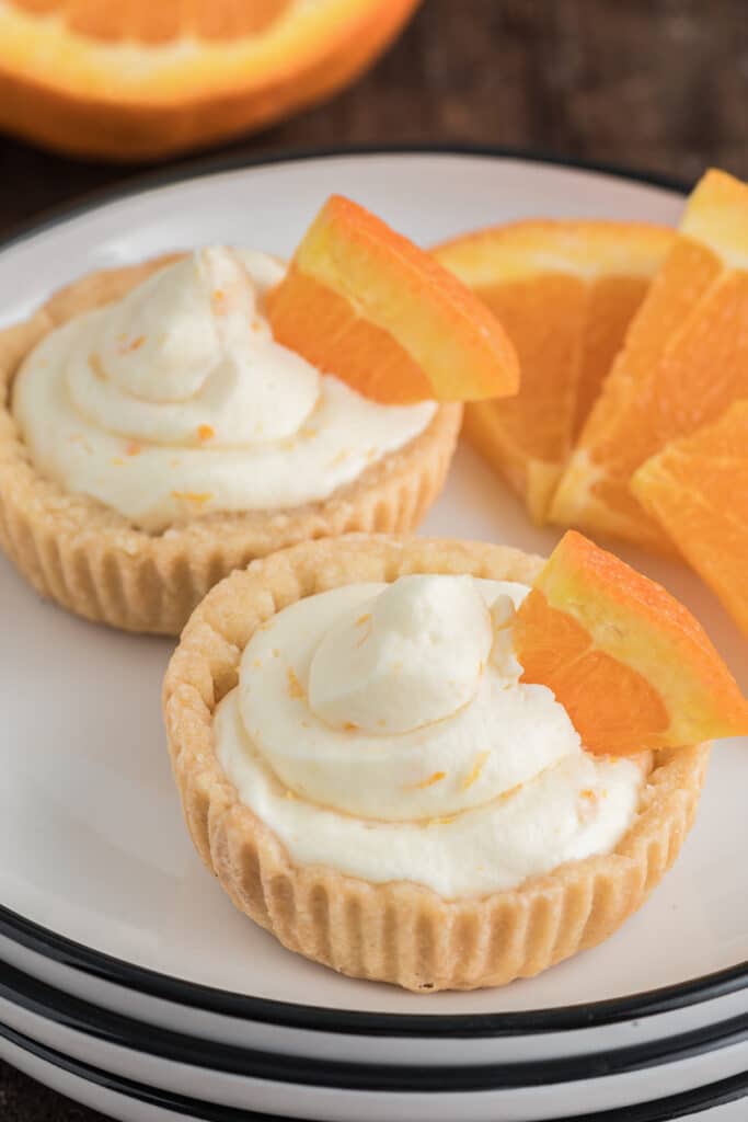 Two tarts on a white plate.