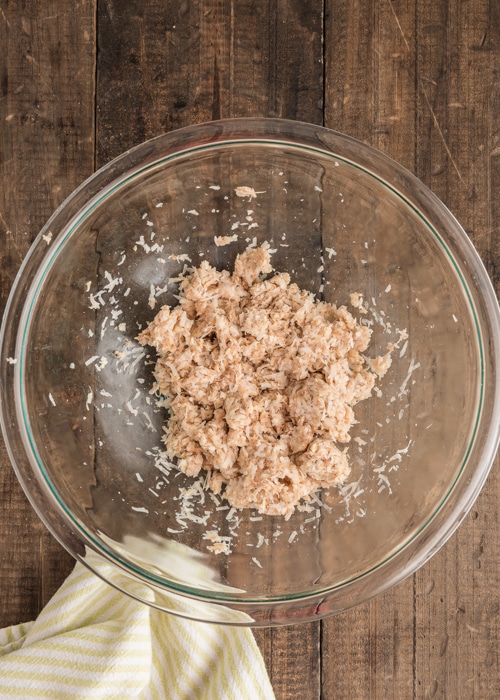 The potato and parm mixture in a glass bowl.