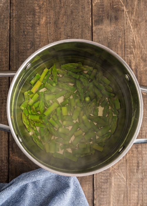 Cooking asparagus in boiling water.