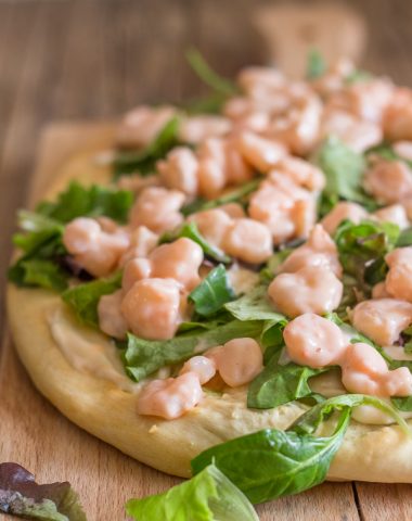 shrimp pizza on a cutting board