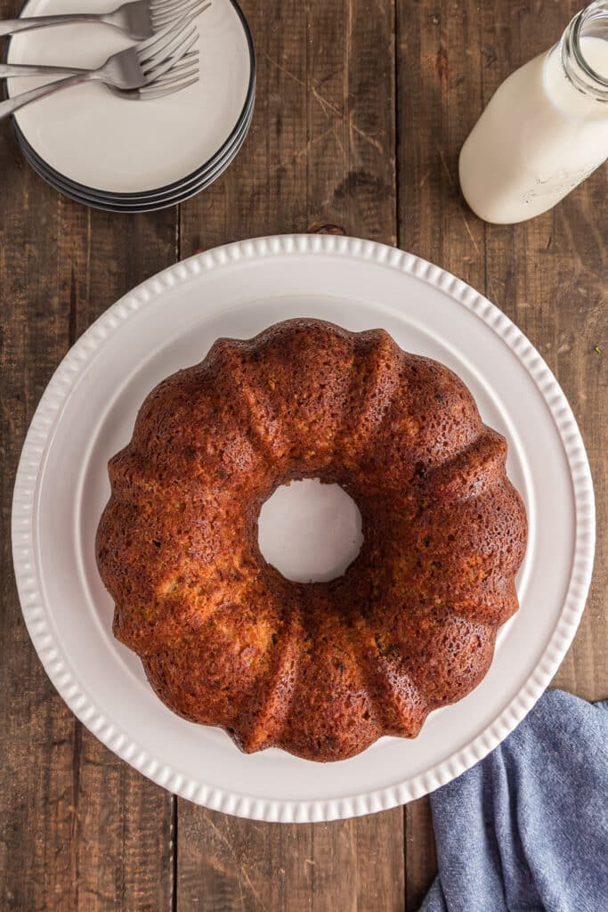 Carrot cake on a white plate.