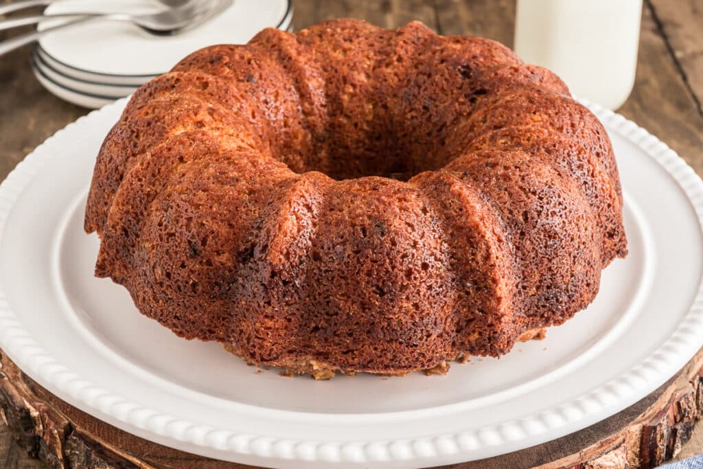 Carrot cake on a white plate.