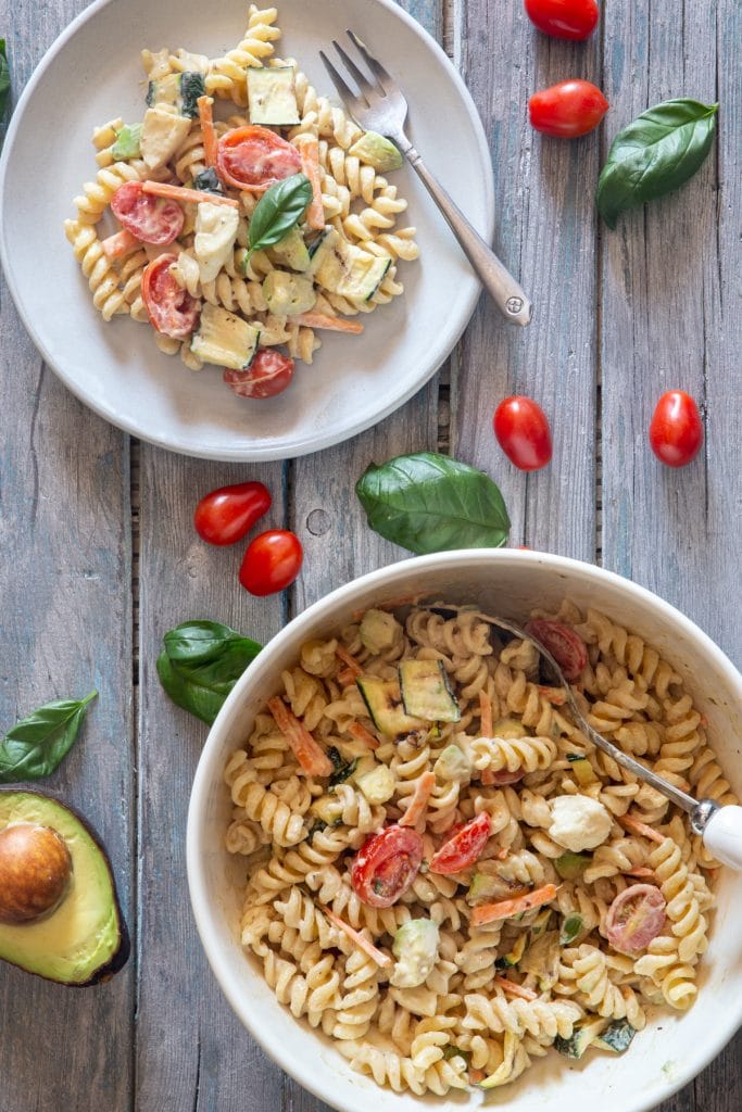 Creamy pasta salad on a plate and in a bowl.