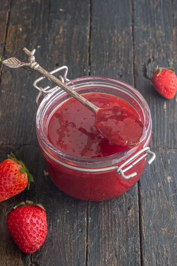 jam in a jar with some on a spoon