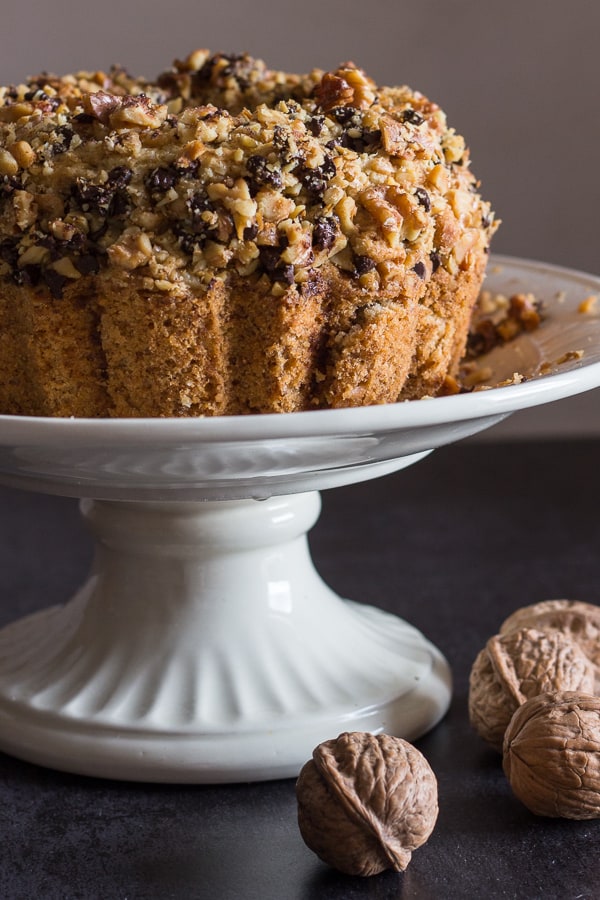 nut & coffee cake on a white cake stand