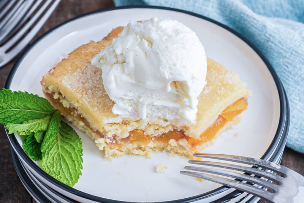 A slice of crostata on a white plate.