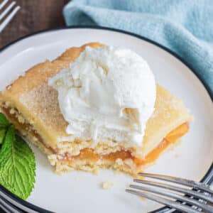 A slice of crostata on a white plate.