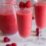 raspberry slushie in 2 glasses and a jug