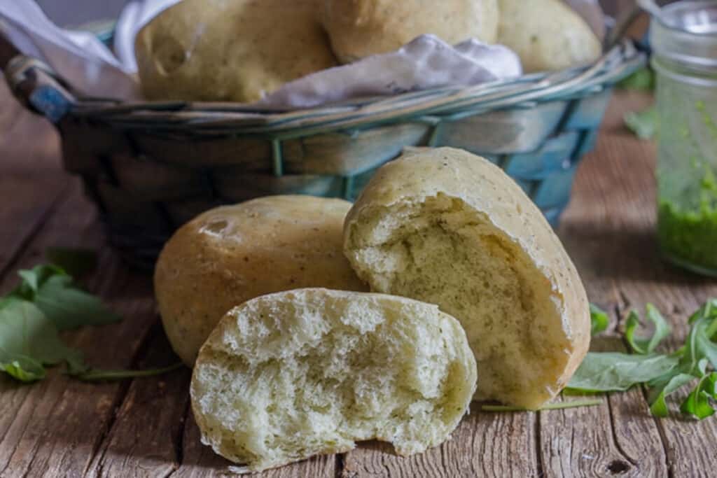 Pesto rolls with one cut in half.