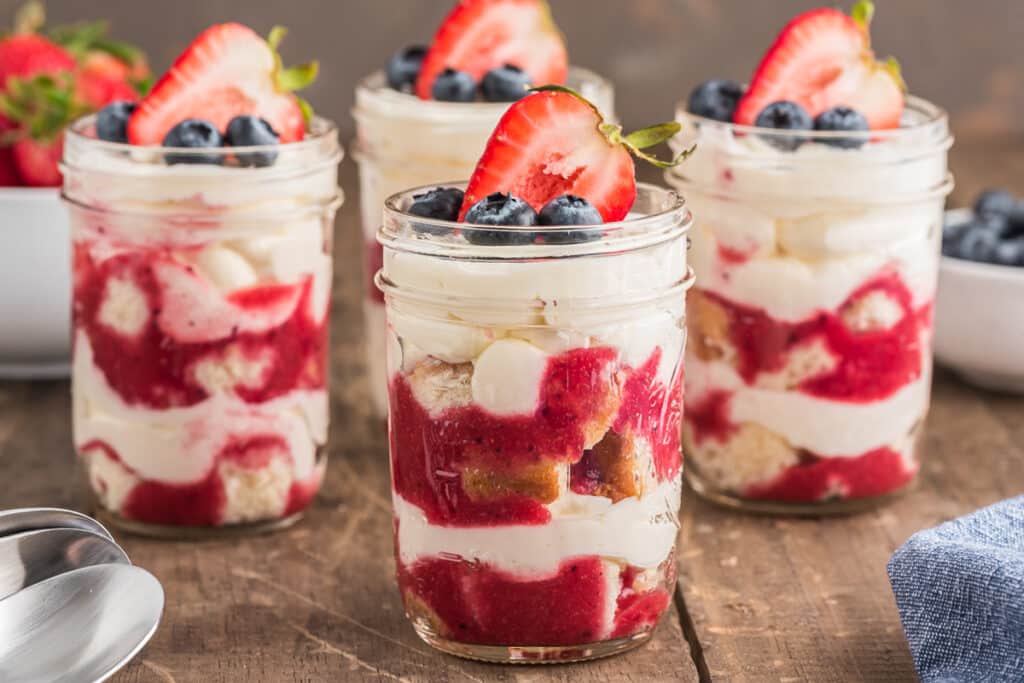 Four parfaits in a glasses.