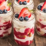 Four parfaits in a glasses.