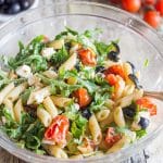 greek pasta salad in a glass bowl