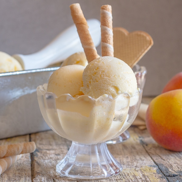 peach ice cream in a bowl
