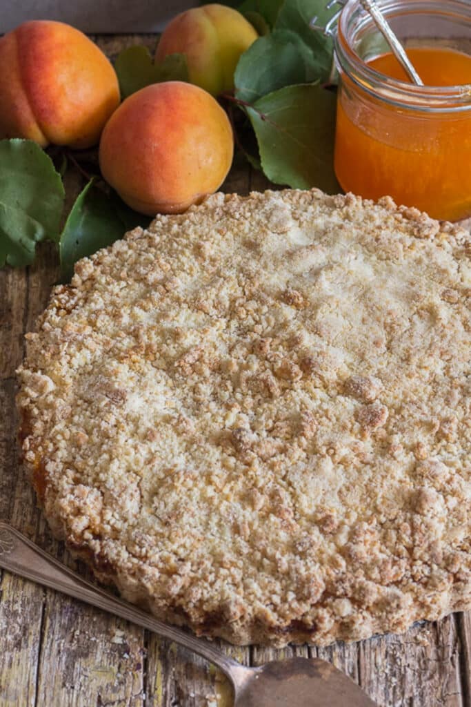 Crumb cake on a wooden board.