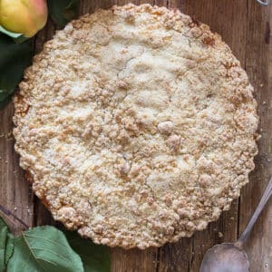 Crumb cake on a wooden board.