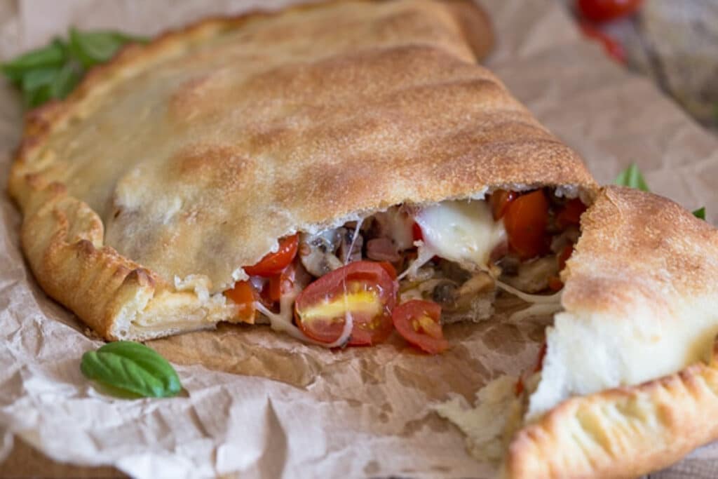the calzone cut in half on paper.