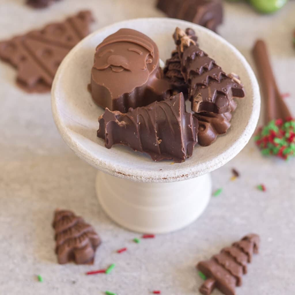 Filled chocolates on a small plate.