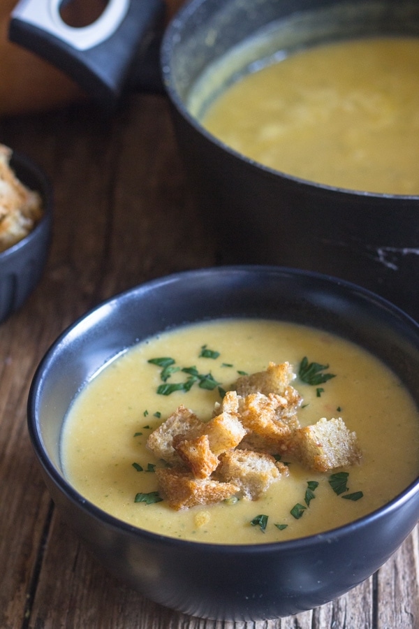 pumpkin soup in a pot and some in a bowl