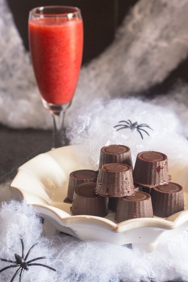 raspberry chocolates on a white plate