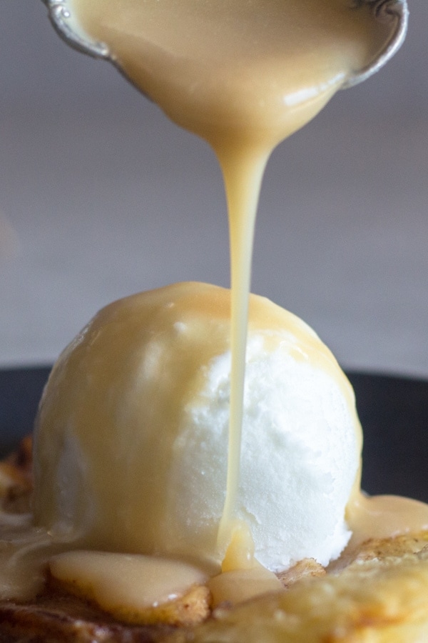 pouring caramel sauce on ice cream