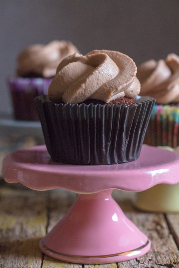 chocolate cupcake on a pink stand