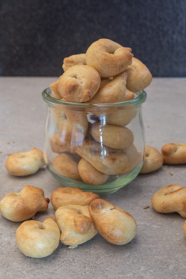 taralli in a class jar and some on the floor.