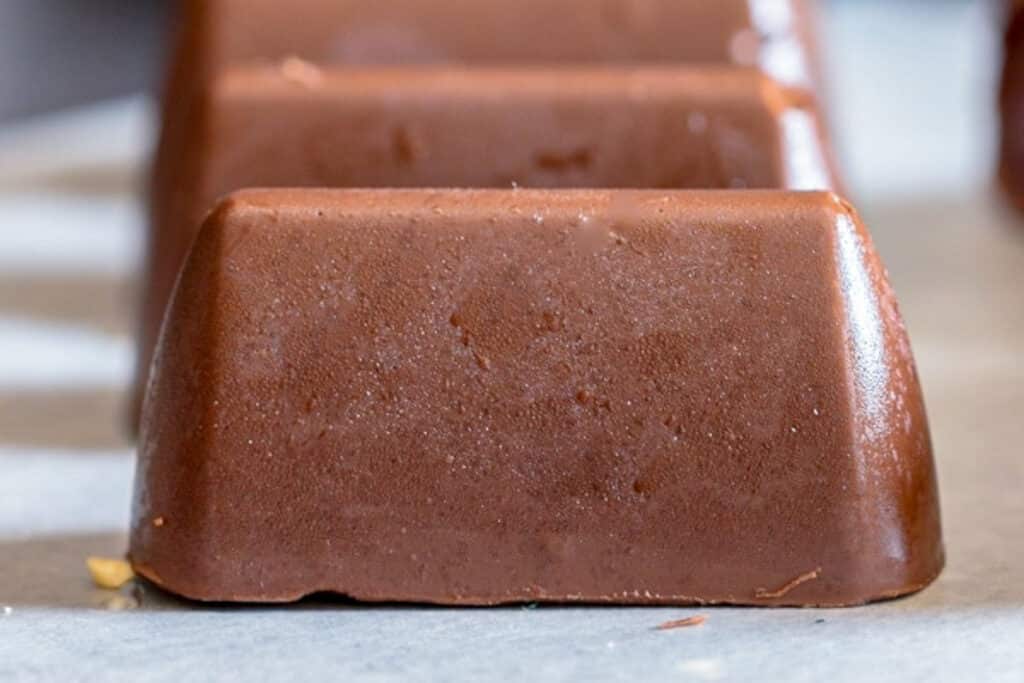 Three chocolate on paper.