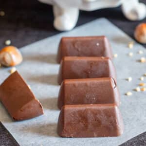 Five chocolates on a piece of paper.