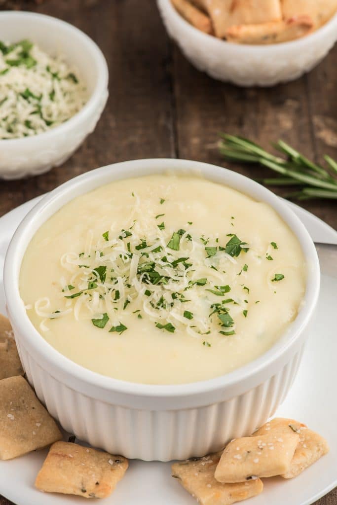 Potato soup in a white bowl.