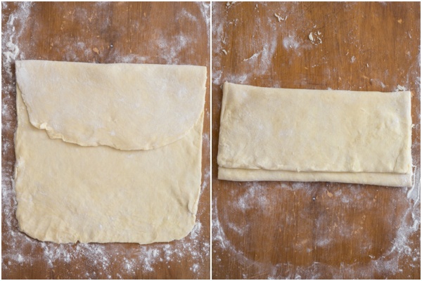 Dough folded on a wooden board.