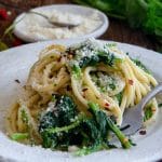 Pasta with broccoli rabe on a white plate.