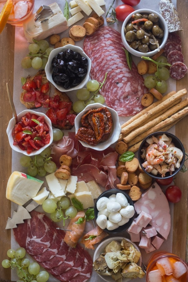 cheese board ingredients on a wooden board