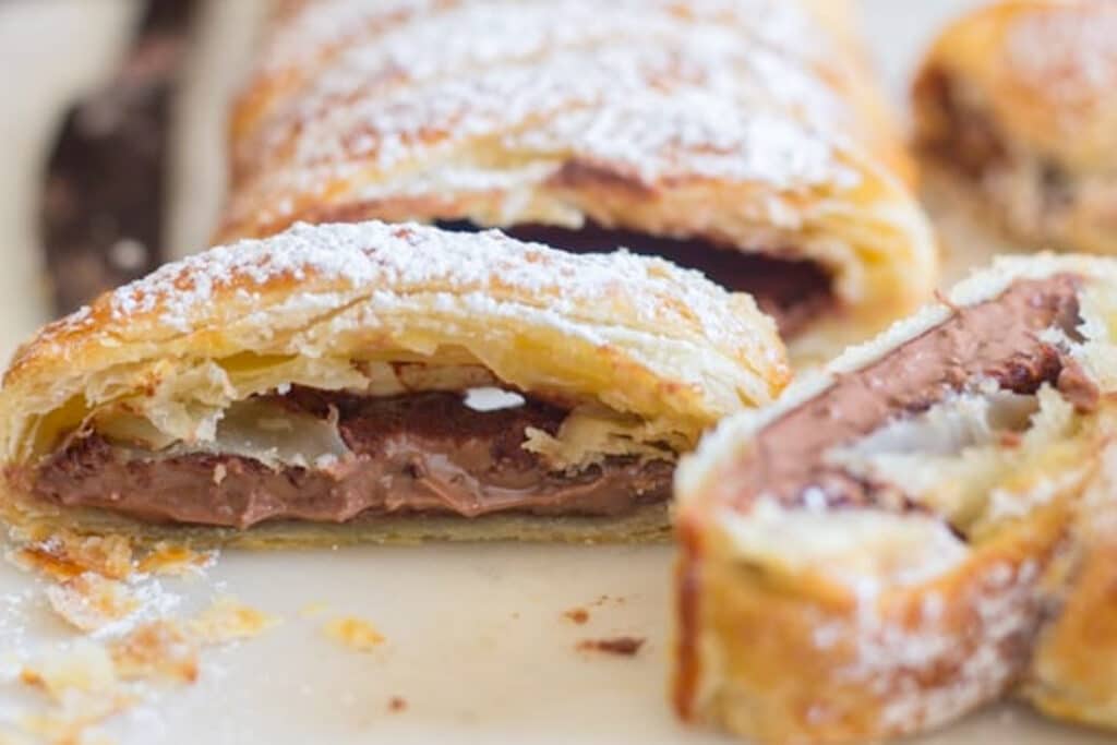 Two slices of braid on a white board.