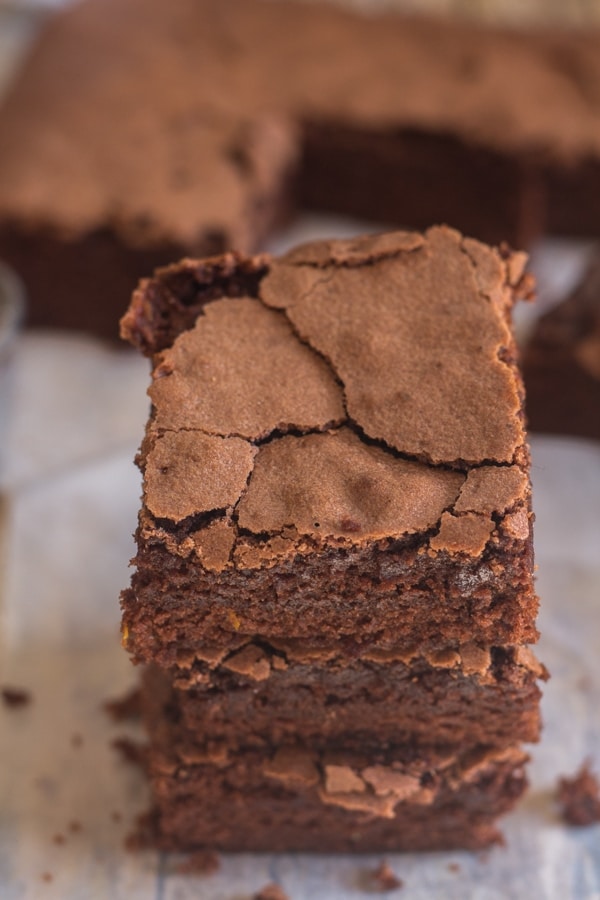 chocolate orange brownies on a piece of parchment paper