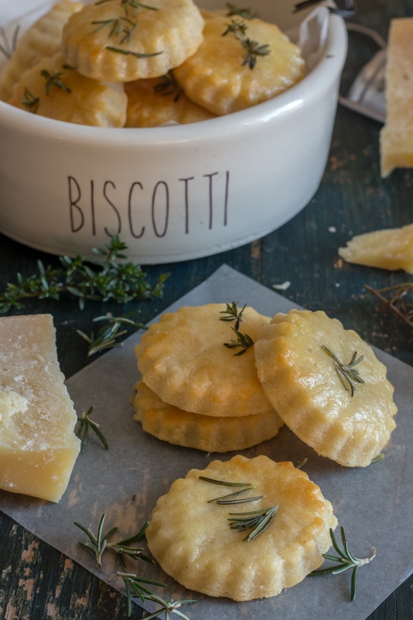 parmesan cookies in a bowl and on a board