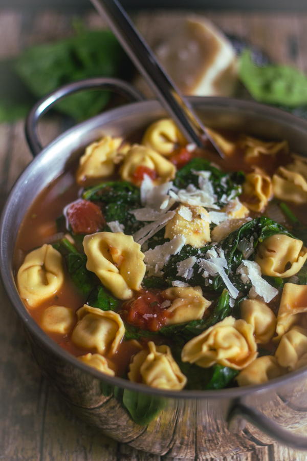 tortellini soup in a silver pot