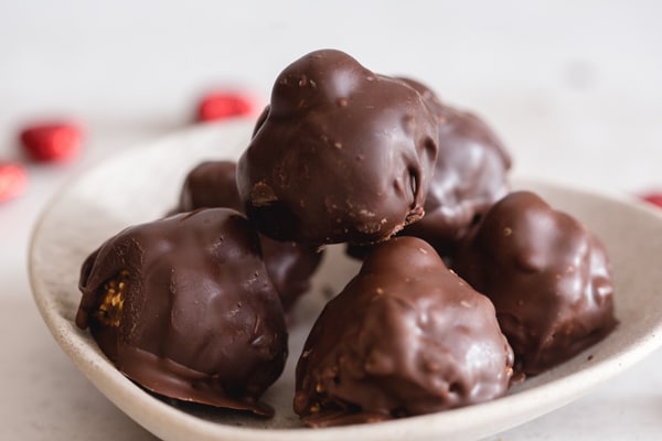 4 chocolates in a white dish